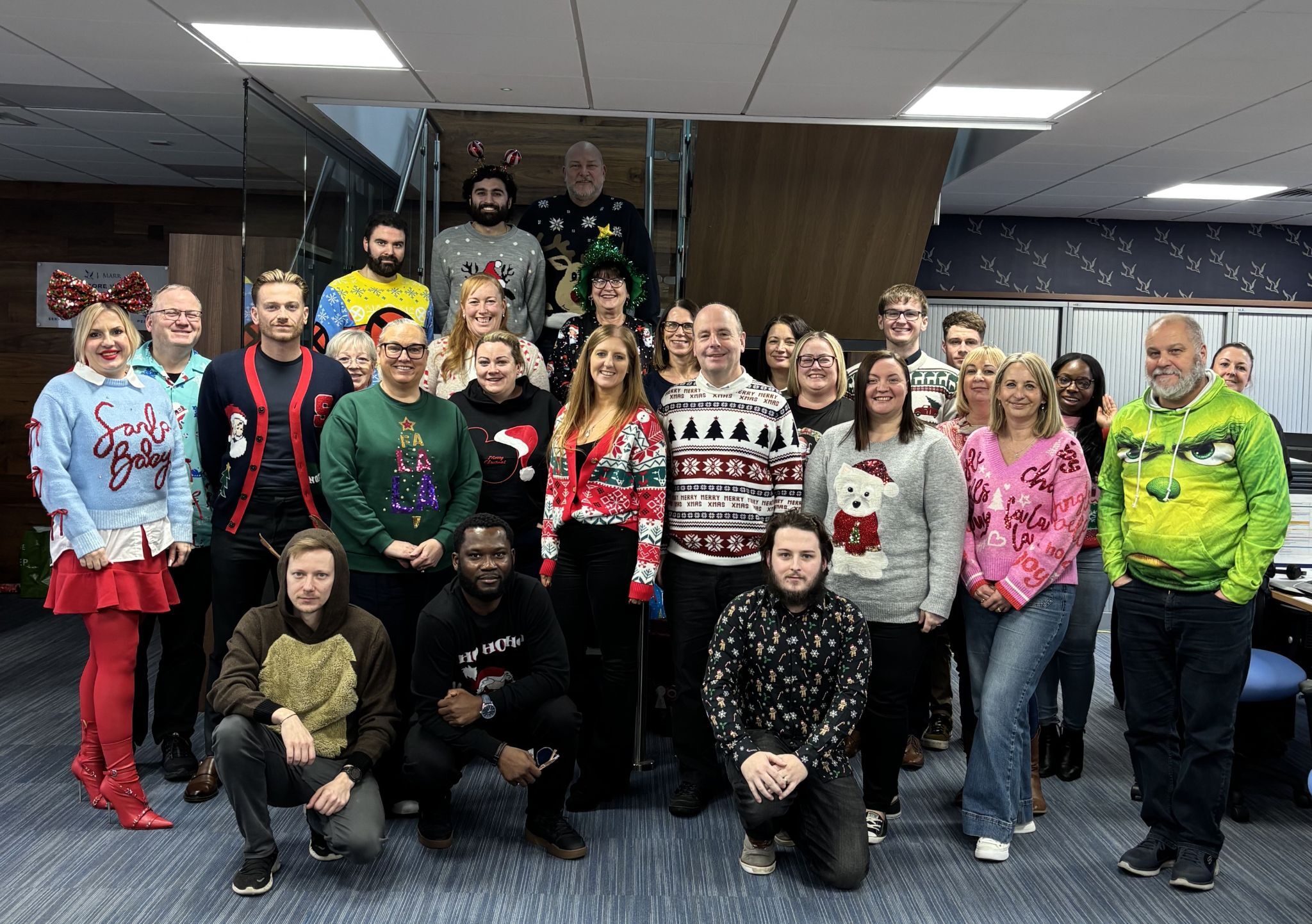 J Marr Team Photo in Christmas Jumpers